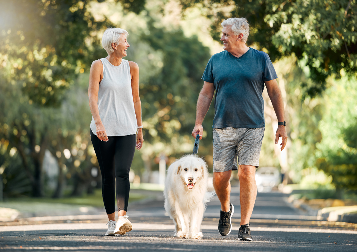 couple-iS-1445417525 walking couple with dog